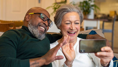 Couple using phone together
