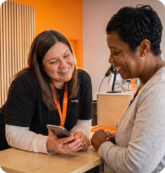 Boost employee helping customer